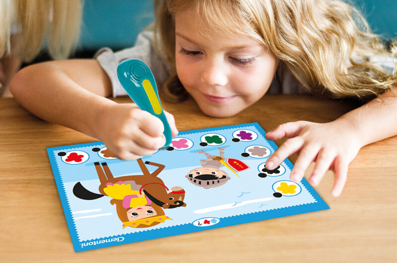 Little girl coloring on a tablet 5582132