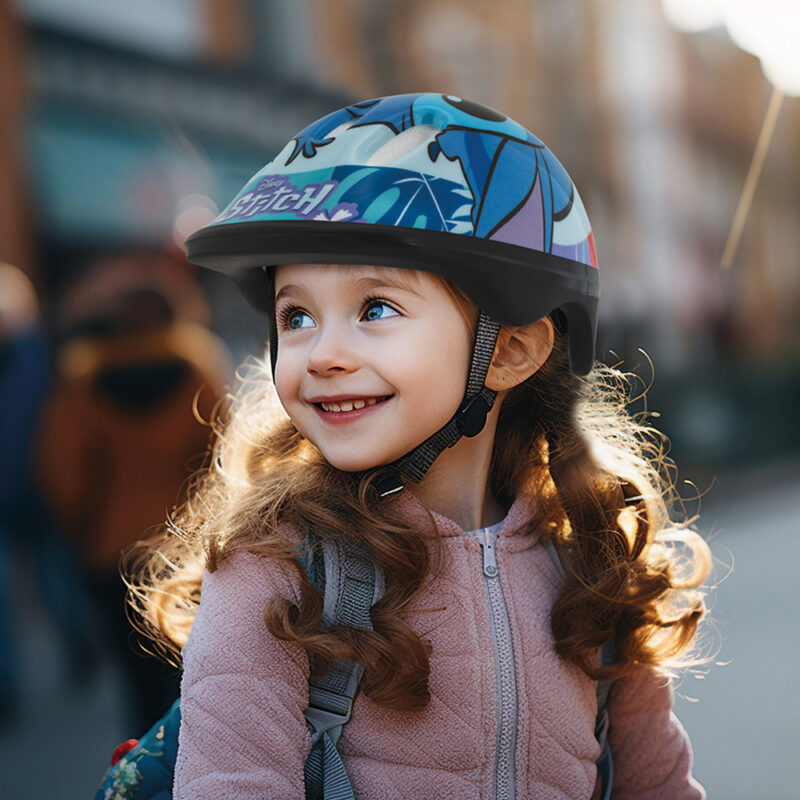 Little girl riding a bike on an asphalt road in the city, wearin 3962349